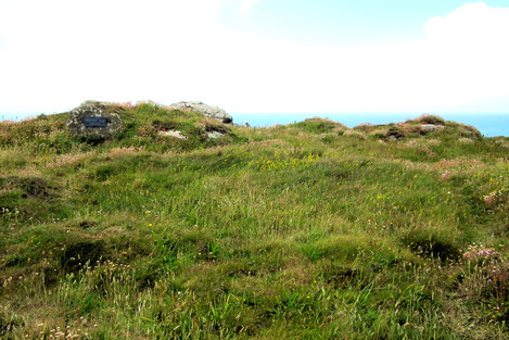 Cairn with cist at Pordenack Point. Altogether there are three cairns and one circular enclosure here - plus a dramatic clifftop headland with many simularcra nearby