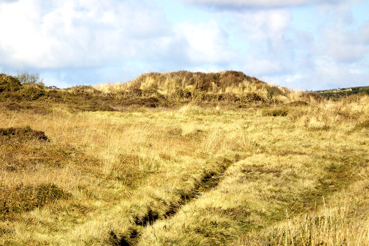 Cairn at Botallack Common, close to Tregeseal stone circle and part of its complex. It has a cist or chamber in it - see left. This cairn might be an early cairn from the late neolithic