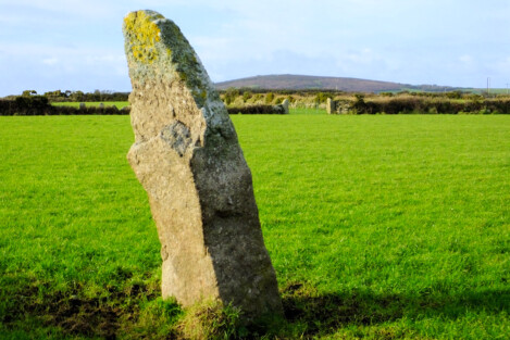 Trevorgans menhir with Chapel Carn Brea behind